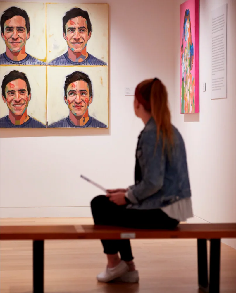 Woman looking at art 